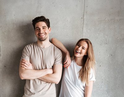 Portrait of adorable caucasian couple man and woman in basic clo